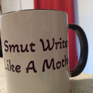 Photo of my new favourite mug, with the words, "Smut Writer Like A Mother."